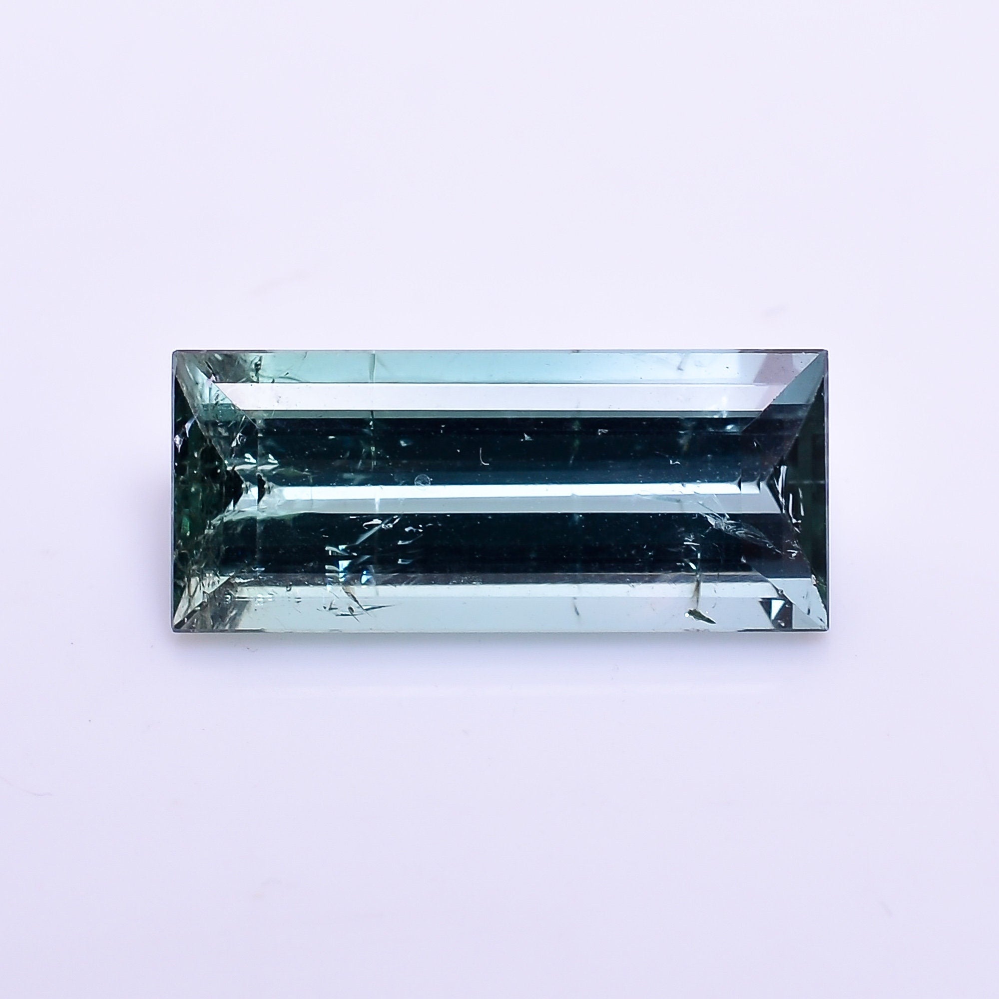 natural blue tourmaline rectangle shape facit cut stone slightly inclusion loose gemstone