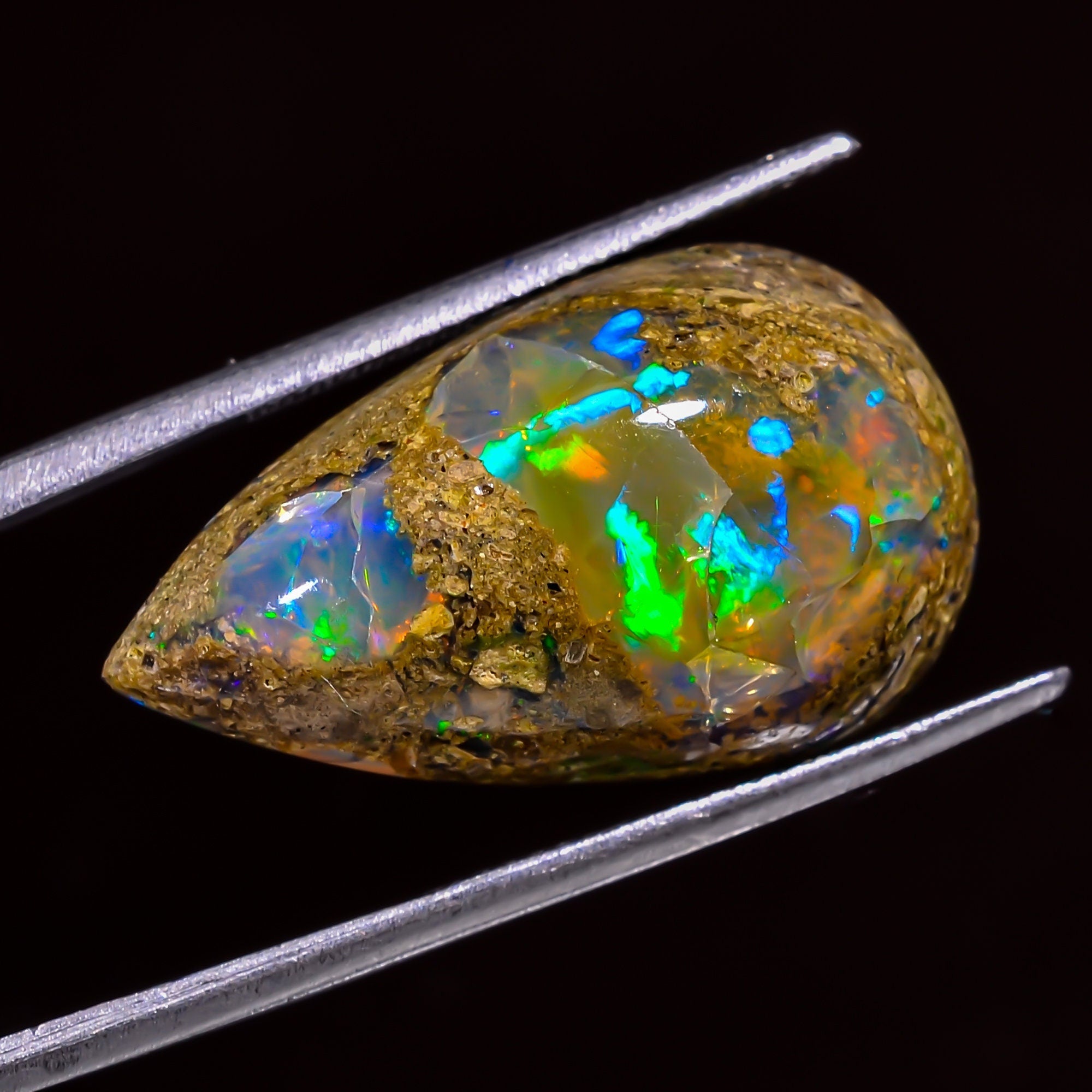 ethiopian opal with matrix pear shape cabochon loose gemstone